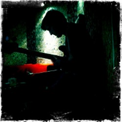 Silhouette of Simon Smith in the studio