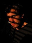 Simon Smith with shadows across his face